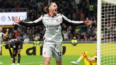 Pemain AC Milan, Adrien Rabiot, melakukan selebrasi setelah mencetak gol ke gawang Torino pada laga Liga Italia di Stadion San Siro, Minggu (22/3/2026) dini hari WIB. (AP Photo/Luca Bruno)