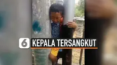 KEPALA BOCAH TERSANGKUT DI ANTARA TIANG LISTRIK