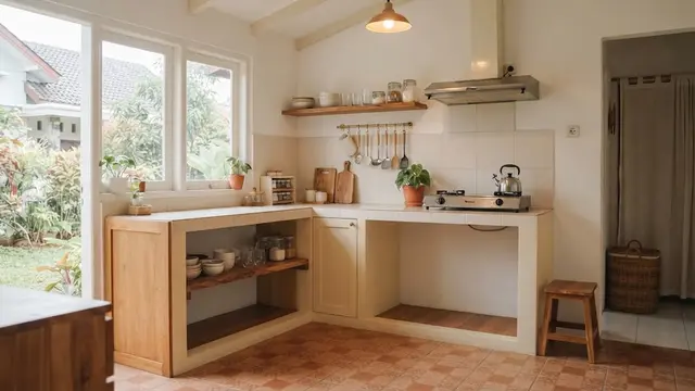 Desain dapur yang tidak terasa pengap dan cocok sebagai ide penataan yang bikin ruangan terasa lebih lega model sisakan area kosong agar dapur terasa lega