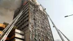 Petugas pemadam menggunakan crane mobil damkar untuk memadamkan kebakaran gedung tertua Iran, gedung Plasco, di pusat kota Teheran, Kamis (19/1). Sedikitnya 38 orang terluka akibat kebakaran di Gedung Plasco yang ikonik tersebut. (AFP PHOTO/STR)
