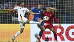 Penyerang Jerman, Thomas Muller berebut bola melawan bek Ukraina Oleksandr Swatok (tengah) dan kiper Anatolij Trubin dalam laga uji coba jelang Piala Eropa 2024 di Stadion Max Morlock, Nurenberg, Selasa (4/6/2024). (Tom Weller/dpa via AP)