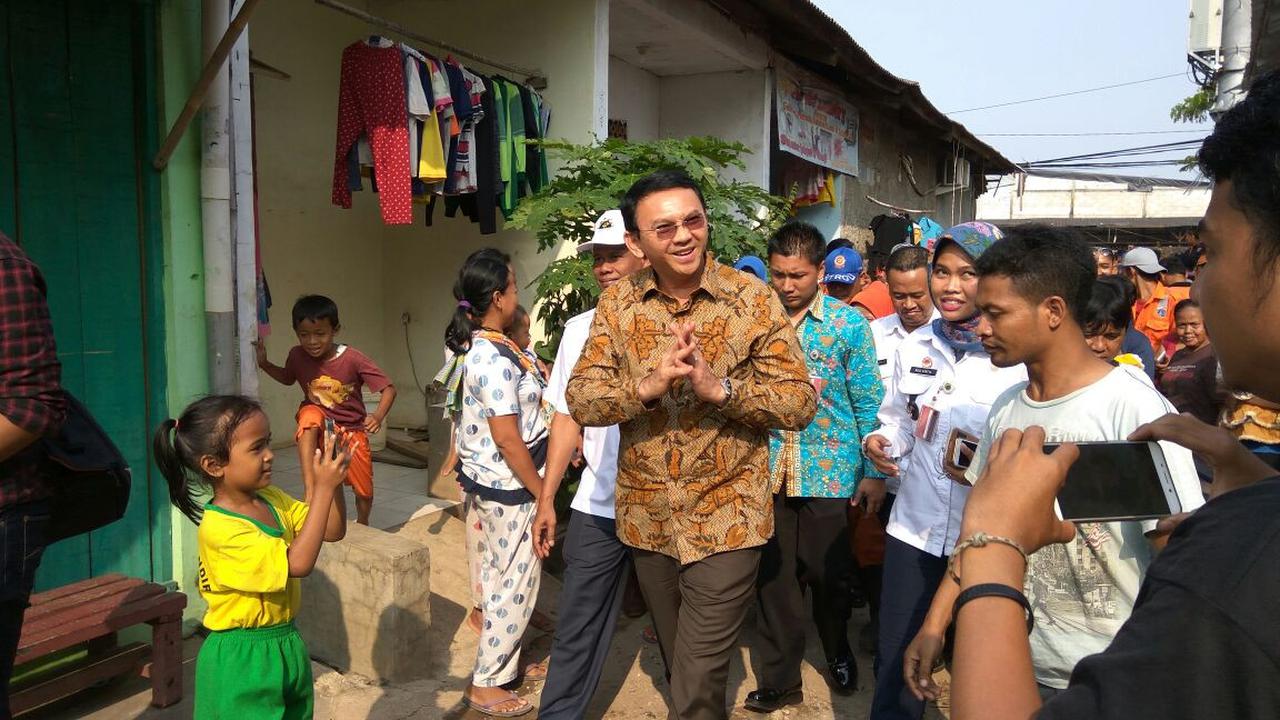 Ahok melayat ke rumah Pasukan Oranye yang terseret banjir