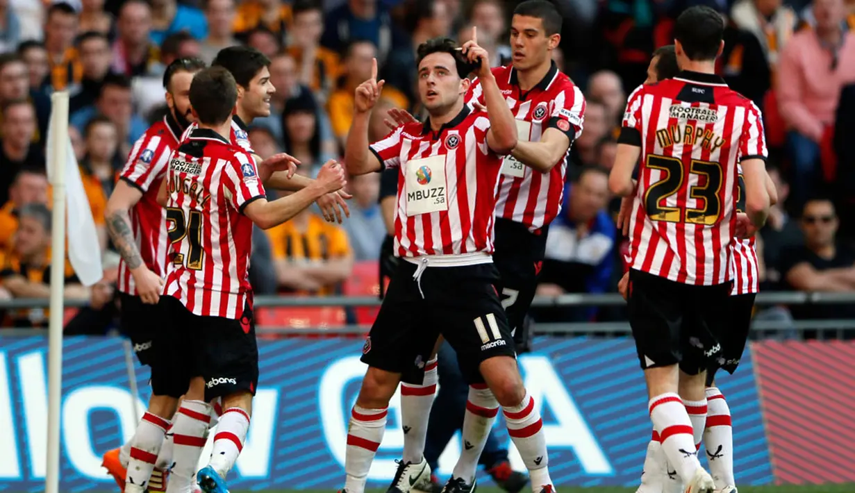 Para pemain Sheffield United merayakan gol yang diciptakan Jose Baxter (tengah) dalam laga semifinal Piala FA kontra Hull City di Stadion Wembley, London (13/4/2014). (REUTERS/Stefan Wermuth)
