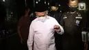 Bupati Hulu Sungai Utara (HSU) Kalimantan Selatan, Abdul Wahid usai diperiksa penyidik di Gedung Merah Putih KPK, Jakarta, Jumat (1/10/2021). Abdul Wahid diperiksa sebagai saksi terkait dugaan suap pengadaan barang dan jasa di Kabupaten Hulu Sungai Utara, Kalsel. (Liputan6.com/Helmi Fithriansyah)