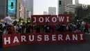 Koalisi masyarakat sipil membawa spanduk dalam menggelar aksi saat kegiatan Car Free Day di Jalan MH Thamrin, Jakarta, Minggu (1/9/2019). Mereka meminta agar Joko Widodo (Jokowi) berani mencoret calon pimpinan (Capim) KPK yang diduga bermasalah. (Liputan6.com/Johan Tallo)
