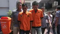 Dua tersangka E dan HM alias TB pemasok narkoba kepada komedian Tri Retno Prayudati alias Nunung dihadirkan saat rilis di Ditresnarkoba Polda Metro Jaya, Jakarta, Kamis (25/7/2019). Tersangka E ditangkap pada Minggu (21/7/2019). (Liputan6.com/Faizal Fanani)