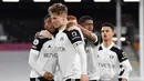 Fulham menjadi klub pertama yang berhasil memastikan diri promosi ke Premier League musim depan. The Whites menjadi juara Championship dengan torehan 90 poin. (AFP/Justin Setterfield/Pool)