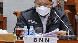 Kepala BNN RI Petrus Reinhard mengikuti rapat kerja dengan Komisi III DPR di Kompleks Parlemen, Jakarta, Kamis (20/1/2022). Raker tersebut membahas evaluasi kinerja pencegahan dan pemberantasan narkotika tahun 2021 dengan Pagu anggaran Rp1,6 triliun. (Liputan6 com/Angga Yuniar)