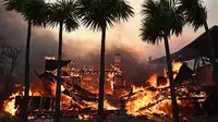 Sedikitnya lima orang tewas dalam kebakaran hutan hebat yang menghanguskan sejumlah kawasan di sekitar Los Angeles, kata para pejabat pada 8 Januari 2025.  (AGUSTIN PAULLIER/AFP)