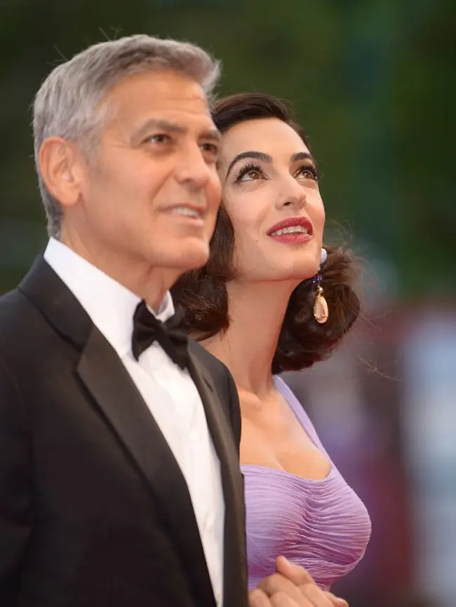 Satu hari sebelum screening film tersebut, George dikabarkan berkumpul dengan teman-temannya untuk makan malam bersama yang masih dalam rangkaian acara tersebut. (AFP/Filippo Monteforte