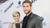 Miley Cyrus dan Chris Hemsworth (AFP)