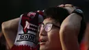 Ekspresi kekecewaan seorang warga Korea Selatan usai tim negaranya dikalahkan Belgia 0-1, Seoul, Jumat (27/6/14). (REUTERS/Kim Hong-Ji)