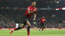 Striker Manchester United, Marcus Rashford, melakukan selebrasi usai membobol gawang Brighton and Hove Albion pada laga Premier League di Stadion Old Trafford, Sabtu (19/1). Manchester United menang 2-1 atas Brighton and Hove Albion. (AP/Martin Rickett)