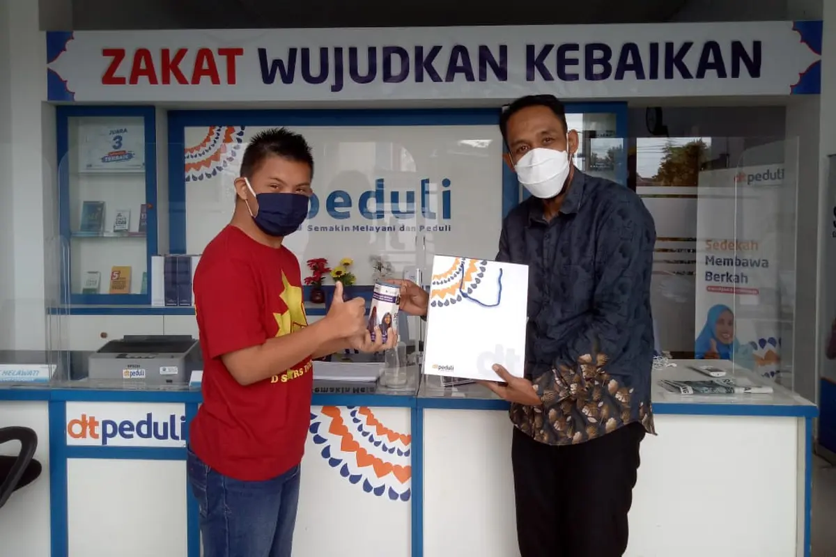 Nabil Dhiya Ulhaq A’isy remaja down syndrome lakukan kegiatan amal di bulan Ramadan.