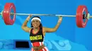 <p>4. Lisa Raema Rumbewas (angkat Besi Putri 48 Kilogram) - Meraih medali perunggu Asian Games 2002. (AFP/Jung Yeon-Je)</p>