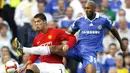 Manchester United's Cristiano Ronaldo vies with Chelsea's Nicolas Anelka during their Premier League match against Chelsea at Stamford Bridge, on September 21, 2008. AFP PHOTO/GLYN KIRK