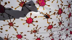 Penyandang disabilitas menjemur kain batik dengan motif virus corona di Surabaya, Jawa Timur (19/8/2020). Di tengah pandemi Covid-19, sekelompok penyandang disabilitas di Surabaya membuat batik bermotifkan virus corona. (AFP/JUNI KRISWANTO)