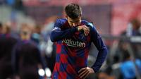 Gerard Pique lesu saat Barcelona dikalahkan Bayern Munchen pada perempat final Liga Champions. (Rafael Marchante / POOL / AFP)
