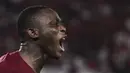 Striker Qatar, Abdulrasheed Umaru, merayakan kemenangan atas Thailand pada laga Piala AFC U-19 di SUGBK, Jakarta, Minggu (28/10). Qatar menang 7-3 atas Thailand. (Bola.com/Vitalis Yogi Trisna)