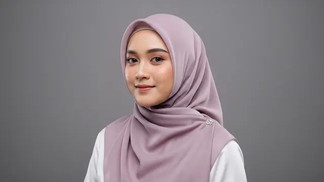 Styling hijab Lebaran yang cocok untuk wajah bulat agar terlihat tirus di foto/Gemini AI