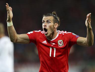 Ekspresi Gareth Bale saat melawan Austria pada laga Group D kualifikasi Piala Dunia 2018 di Cardiff City Stadium, Cardiff, (2/8/2017). Wales menang 1-0. (David Davies/PA via AP)