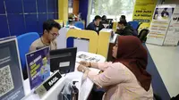 Jelang batas akhir pelaporan Surat Pemberitahuan Tahunan (SPT) yang jatuh pada 31 Maret 2024, jumlah pelapor pajak penghasilan mengalami peningkatan. (Liputan6.com/Angga Yuniar)