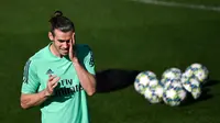 Penyerang Real Madrid Gareth Bale saat sesi latihan di kompleks latihan Valdebebas, Madrid, Spanyol, Senin (30/9/2019). Real Madrid bersiap jelang menjamu Club Brugge dalam laga Liga Champions. (PIERRE-PHILIPPE MARCOU/AFP)