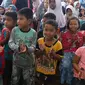 Anak-anak korban Gempa terlihat antusias saat mengikuti kegiatan "Trauma Healing" di Pidie Jaya, Aceh, Jumat (9/12). Kegiatan tersebut untuk memulihkan rasa trauma anak-anak korban gempa bumi di Pidie Jaya. (Liputan6.com/Angga Yuniar)