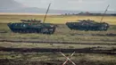 Kendaraan militer China berpartisipasi dalam latihan militer Vostok-2018 di Tsugol, Siberia timur, Kamis (13/9). Latihan militer Rusia bersama Rusia ini akan berlangsung selama seminggu ke depan di wilayah Rusia tengah dan timur. (AFP/Mladen Antonov)