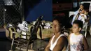 Beberapa anak harus beristirahat di luar rumah mereka setelah gempa bumi berkekuatan 4,9 skala richter kembali mengguncang Managua, Minggu malam (13/4/2014) waktu setempat. (REUTERS/Jorge Cabrera)