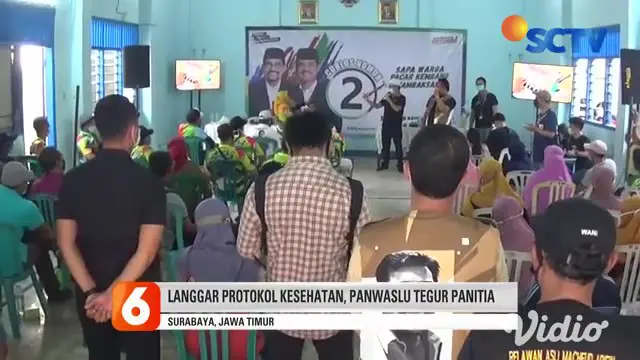 Terjadi pelanggaran protokol kesehatan dalam kampanye Pilkada Machfud Arifin sebagai Calon Wali Kota Surabaya, Jawa Timur. Terlihat puluhan warga berkerumun di Balai RW Tambaksari, dengan tidak menjaga jarak.