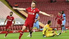 Pemain Liverpool, Diogo Jota, melakukan selebrasi usai mencetak gol ke gawang West Ham United pada laga Liga Inggris di Stadion Anfield,  Minggu (1/11/2020). Liverpool menang dengan skor 2-1. (Peter Powell/Pool via AP)