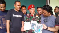 Alun yang merupakan masyarakat Kendari, Provinsi Sulawasi Tenggara itu diamankan di Makodim 1304 Gorontalo karena menjadi anggota TNI gadungan. (Liputan6.com/Arfandi Ibrahim)