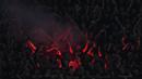 Para suporter AC Milan menyalakan flare saat memberi dukungan kepada timnya saat menghadapi Newcastle United pada laga matchday pertama Grup F Liga Champions 2023/2024 menghadapi AC Milan di San Siro Stadium, Milan, Rabu (20/9/2023) dini hari WIB. (AP Photo/Antonio Calanni)