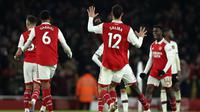 Para pemain Arsenal melakukan selebrasi usai pertandingan sepak bola Liga Inggris antara Arsenal dan Manchester United di stadion Emirates di London, Minggu, 22 Januari 2023. (AP Photo/Ian Walton)