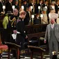 Pangeran Charles antar Meghan Markle ke altar. (JONATHAN BRADY / POOL / AFP)