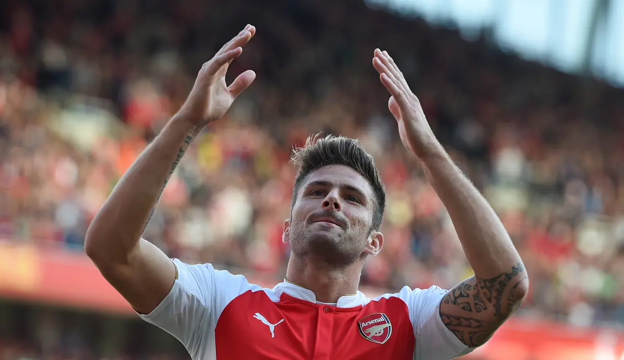 Ekspresi Olivier Giroud setelah mencetak gol kedua Arsenal ke gawang Stoke City dalam lanjutan Liga Premier Inggris di Stadion Emirates, London. Sabtu (12/9/2015). (Reuters/Alan Walter)