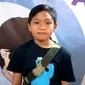 Fulki Baharuddin Prihandoko termasuk anak penyintas diabetes yang harus disuntik insulin selama hidupnya. (Liputan6.com/Fitri Haryanti Harsono)