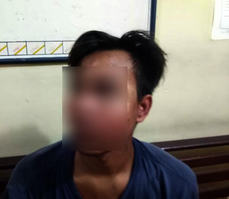 Salah satu terduga pembunuh satu keluarga di Kota Medan, Sumatera Utara, yang ditangkap. (Foto: Istimewa/Reza Efendi)