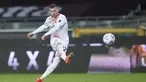 Striker AC Milan, Ante Rebic melepaskan tendangan yang berbuah gol kelima timnya ke gawang Torino dalam laga lanjutan Liga Italia 2020/2021 pekan ke-36 di Olympic Stadium, Turin, Rabu (12/5/2021). AC Milan menang 7-0 atas Torino. (LaPresse via AP/Spada)