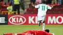 Selebrasi bek Nigeria, Musa Yahaya setelah mencetak gol ke gawang Meskiko pada laga final Piala Dunia U-17 2013 di Mohammed bin Zayed Stadium, Uni Emirat Arab (8/11/2013). Pada Piala Dunia U-17 2013 yang digelar di Uni Emirat Arab pada 17 Oktober hingga 8 November 2013, Nigeria sukses menjadi juara setelah mengalahkan Meksiko dengan skor 3-0 di laga final. Gol-gol kemenangan Meksiko dicetak melalui gol bunuh diri Erick Aguirre (9'), Kelechi Iheanacho (56') dan Musa Yahaya (81'). (AFP/Marwan Naamani)