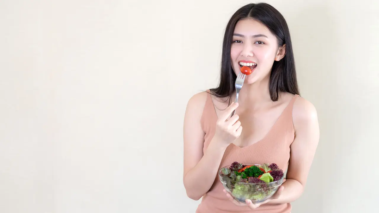 wanita oktober perut tidak buncit