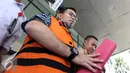 Budi Antoni Aljufri menjawab pertanyaan wartawan usai menjalani pemeriksaan, Jakarta, Selasa (14/7/2015). Budi diperiksa terkait kasus suap mantan Ketua MK, Akil Mochtar dalam Pilkada Kabupaten Empat Lawang. (Liputan6.com/Helmi Afandi)