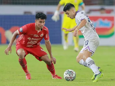 Bek muda Persija Jakarta, Muhammad Ferarri, sukses membayar kepercayaan pelatih Thomas Doll untuk menjaga lini pertahanan Macan Kemayoran. (Bola.com/M Iqbal Ichsan)