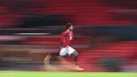 Penyerang andalan Manchester United, Marcus Rashford berlari kencang dalam pertandingan Piala FA di Old Trafford. (Foto: AP/Pool/Laurence Griffiths)