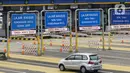 Kendaraan melintasi Gerbang Tol Pondok Ranji di Tangerang Selatan, Banten, Senin (18/1/2021). Kenaikan tarif jalan tol lingkar luar Jakarta (JORR) berlaku mulai 17 Januari 2021. (Liputan6.com/Johan Tallo)