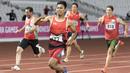 Purnomo Sapto Yogo pelari Indonesia meraih medali emas di nomor 100 meter putra klasifikasi T37 pada Asian Para Games 2018, di Stadion Utama Gelora Bung Karno Jakarta, Selasa (9/10/2018).  (Bola.com/Peksi Cahyo)