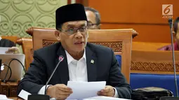 Ketua Pansus RUU Antiterorisme Muhammad Syafi'i  memimpin rapat RUU Nomor 15 Tahun 2003, Jakarta, Rabu (23/5). Revisi UU ini terkait desakkan publik dan ancaman penerbitan Perppu Presiden Jokowi menyusul serangkaian aksi teror. (Liputan6.com/Johan Tallo)