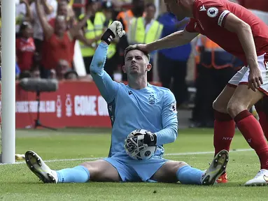 Dean Henderson tengah menjadi sorotan usai penampilan apiknya yang membuat Nottingham Forest berhasil mengantongi kemenangan perdana di Liga Inggris musim 2022/2022. (AP/Rui Vieira)