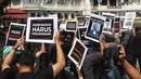 Wartawan yang tergabung dalam PWI Malang Raya, AJI Malang, IJTI Korda Malang, dan PFI Malang menyampaikan pernyataan sikap saat aksi damai di Bundaran Tugu Kota Malang, Senin (27/7/2026). (PFI Malang)